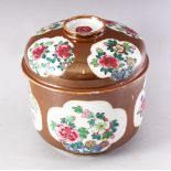 A 19TH CENTURY CHINESE CAFE AU LAIT GLAZED BOWL AND COVER, painted with panels of chrysanthemums,