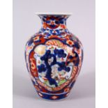 A JAPANESE MEIJI PERIOD IMARI PORCELAIN VASE, decorated with panel views of pine trees, phoenix
