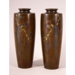 A GOOD SMALL PAIR OF MID 20TH CENTURY JAPANESE MIXED METAL VASES, each depicting a cockerel seated