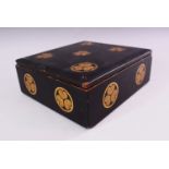 A JAPANESE LACQUER BOX AND COVER, decorated with circular mon, 22cm x 20cm.