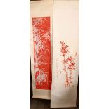 TWO CHINESE RED INK SCROLL PICTURES, both depicting bamboo, both with a calligraphic script,