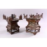 A MATCHED PAIR OF 19TH CENTURY CHINESE SPELTER PAGODA FORM CANDLE STANDS, with cast and pierced