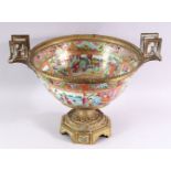 A GOOD 19TH CENTURY CANTON PORCELAIN BOWL, with French ormolu mounts, the bowl painted with panels