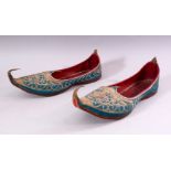 A PAIR OF TURKISH EMBROIDERED LEATHER SHOES.