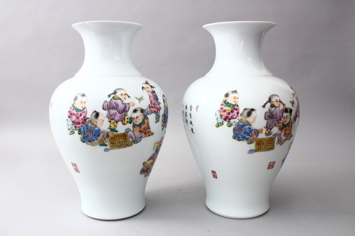 A PAIR OF CHINESE REPUBLIC PERIOD FAMILLE ROSE PORCELAIN VASES OF BOYS PLAYING, the body of the - Image 2 of 6