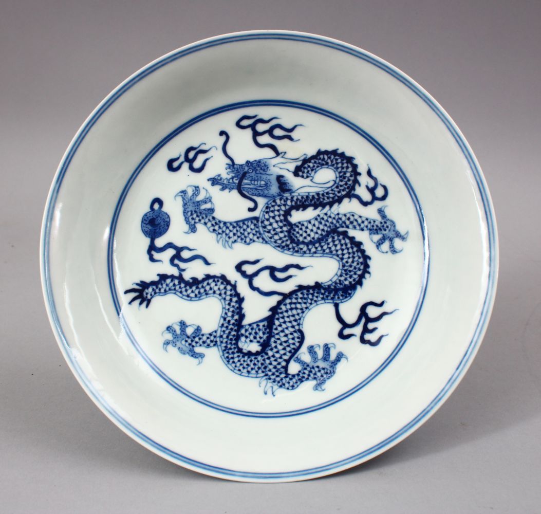 A CHINESE BLUE & WHITE PORCELAIN YONGZHENG STYLE DRAGON DISH, decorated with a central dragon, the