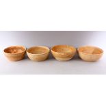 A GROUP OF FOUR EARLY CHINESE EARTHENWARE CIRCULAR BOWLS, various sizes.