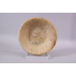 AN EYGPTIAN ALABASTER SHALLOW CIRCULAR BOWL, 23cm diameter.