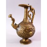 A 19TH CENTURY INDIAN MOULDED BRASS JUG, with moulded elephant head spout and dog handle, the body