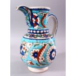 A 19TH CENTURY KUTAHYA JUG, decorated in the Iznik taste, 26cm high.