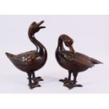 A PAIR OF CHINESE BRONZE FIGURES OF DUCKS, both in standing positions with detailed carvings of