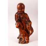 A CHINESE CARVED ROOTWOOD FIGURE OF A SAGE, 29cm high.