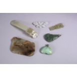 SIX JADE AND JADITE PENDANTS, and other pieces.