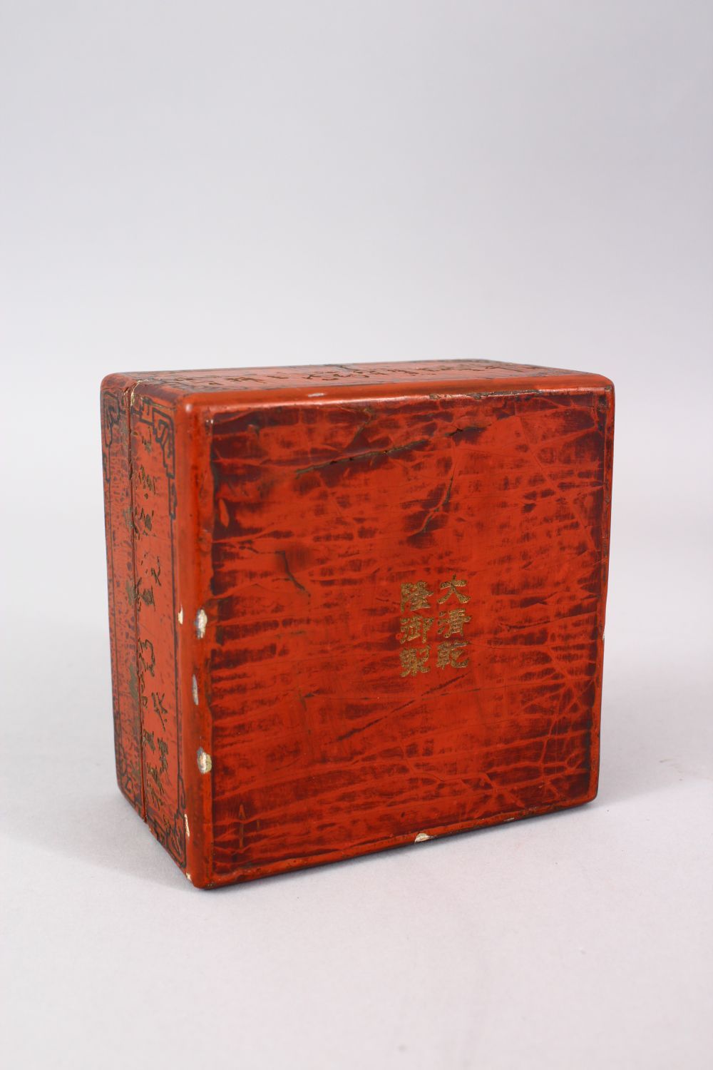 A CHINESE RED LACQUER SQUARE FORM CALLIGRAPHIC BOX & COVER, the base with a gilded mark, 12cm - Image 3 of 4