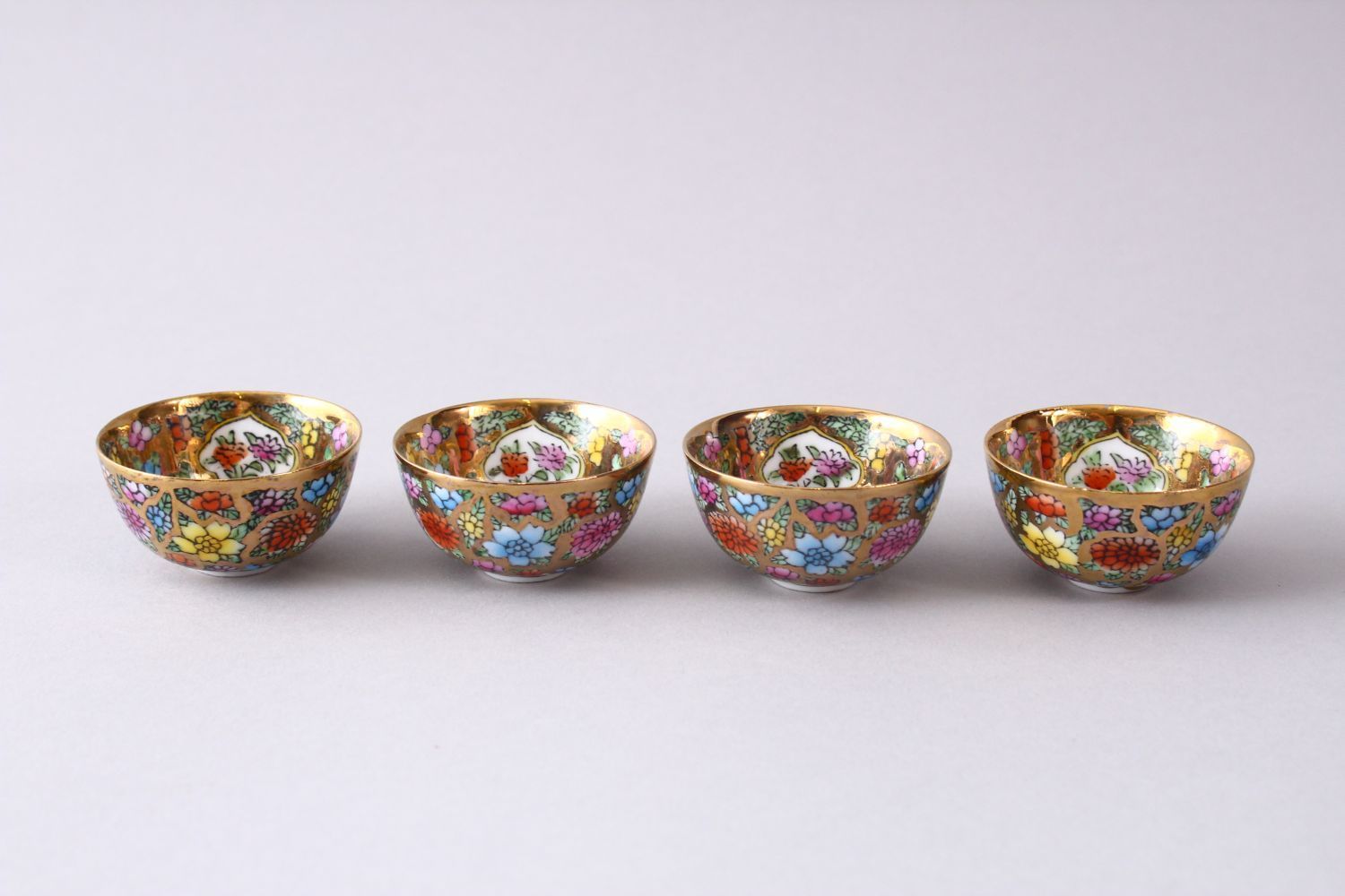 FOUR CHINESE REPUBLIC STYLE PORCELAIN CUPS IN BOX, decorated upon a gilt ground with flora and - Image 2 of 4