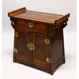 AN EARLY 20TH CENTURY CHINESE ALTER STYLE CABINET with scroll ends, a single small drawer over a