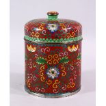 A 19TH / 20TH CENTURY CHINESE CLOISONNE CYLINDRICAL BOX AND COVER, decorated upon a red ground