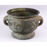 A 19TH CENTURY CHINESE BRONZE IMMORTAL TWIN HANDLED CENSER, with carved panel decoration depicting