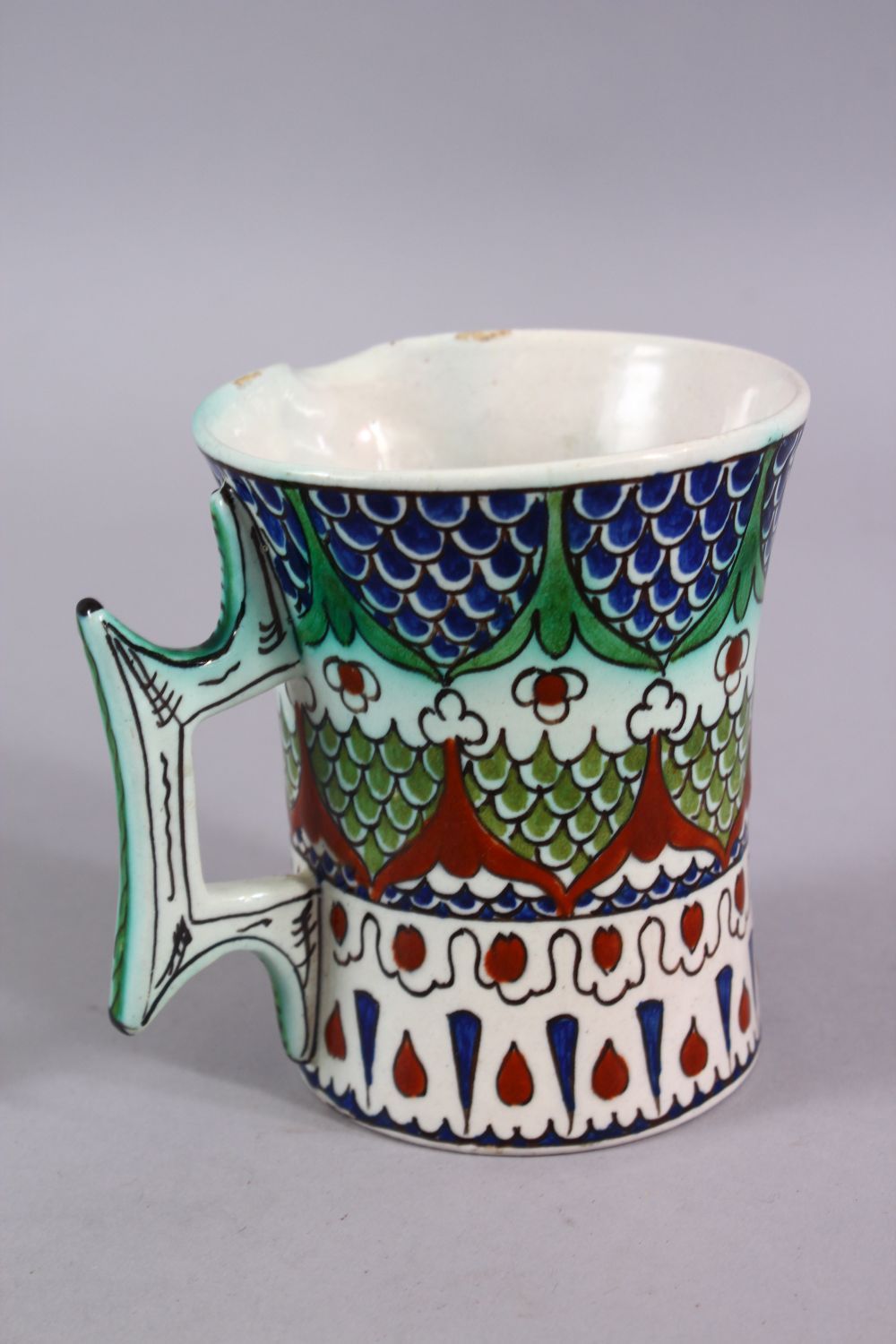 A 19TH CENTURY IZNIK STYLE CANTAGALLI JUG, with floral panel motif, 10cm. - Image 3 of 4