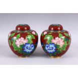 A PAIR OF CHINESE CLOISONNE GINGER JARS AND COVERS, decorated with a bird amongst flowers, 16cm