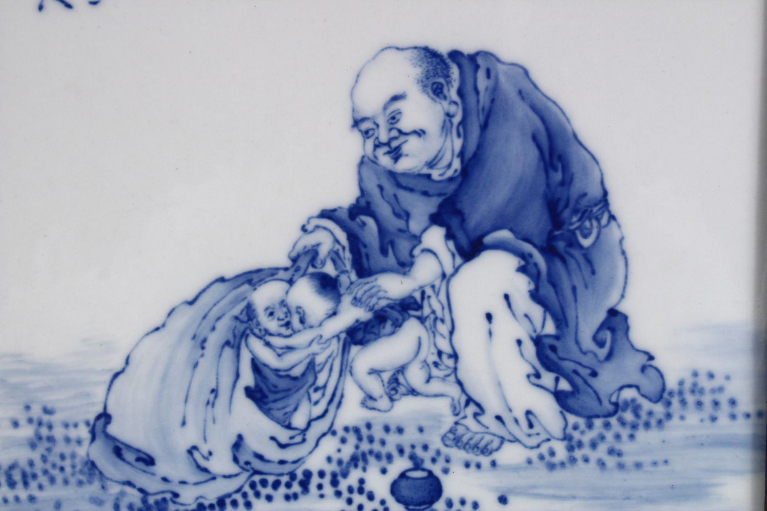 A GOOD CHINESE BLUE & WHITE PORCELAIN FRAMED TILE OF LUOHAN AND CHILDREN, in a landscape setting, - Image 2 of 4