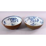 A PAIR OF CHINESE NANKING CARGO SHIPWRECK BOWLS, the interior with blue and white floral decoration,