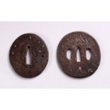 TWO 19TH CENTURY JAPANESE CAST IRON TSUBA, each with engraved and inlaid decoration, 7cm and 7.5cm.