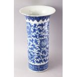 A 19TH CENTURY CHINESE BLUE AND WHITE PORCELAIN SLEEVE VASE, with flared rim, floral decoration