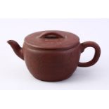 A CHINESE YIXING CLAY CALLIGRAPHY TEA POT, the body of the pot with carved calligraphy, also to