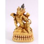 A TIBETAN GILT BRONZE FIGURE OF A SEATED FEMALE DIETY, 20cm high.