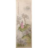 A 20TH CENTURY CHINESE SCROLL PAINTING, depicting a young lady standing a landscape setting