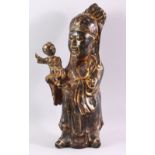 A CHINESE CAST BRONZE FIGURE OF A BEARDED SAGE, holding a small boy in his arms, with traces of