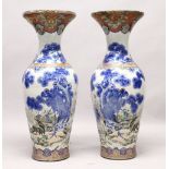 A LARGE PAIR OF JAPANESE MEIJI PERIOD BLUE AND WHITE PORCELAIN IMARI VASES, the body of the vases