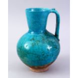 A GOOD EARLY TURQUOISE GLAZED POTTERY EWER, 20cm high.