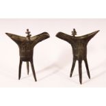 A SMALL PAIR OF CHINESE ARCHAIC FORM CAST BRONZE TRIPOD CENSERS, 13cm.