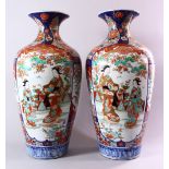A LARGE PAIR OF JAPANESE MEIJI PERIOD IMARI PORCELAIN VASES, with panel decoration depicting figures