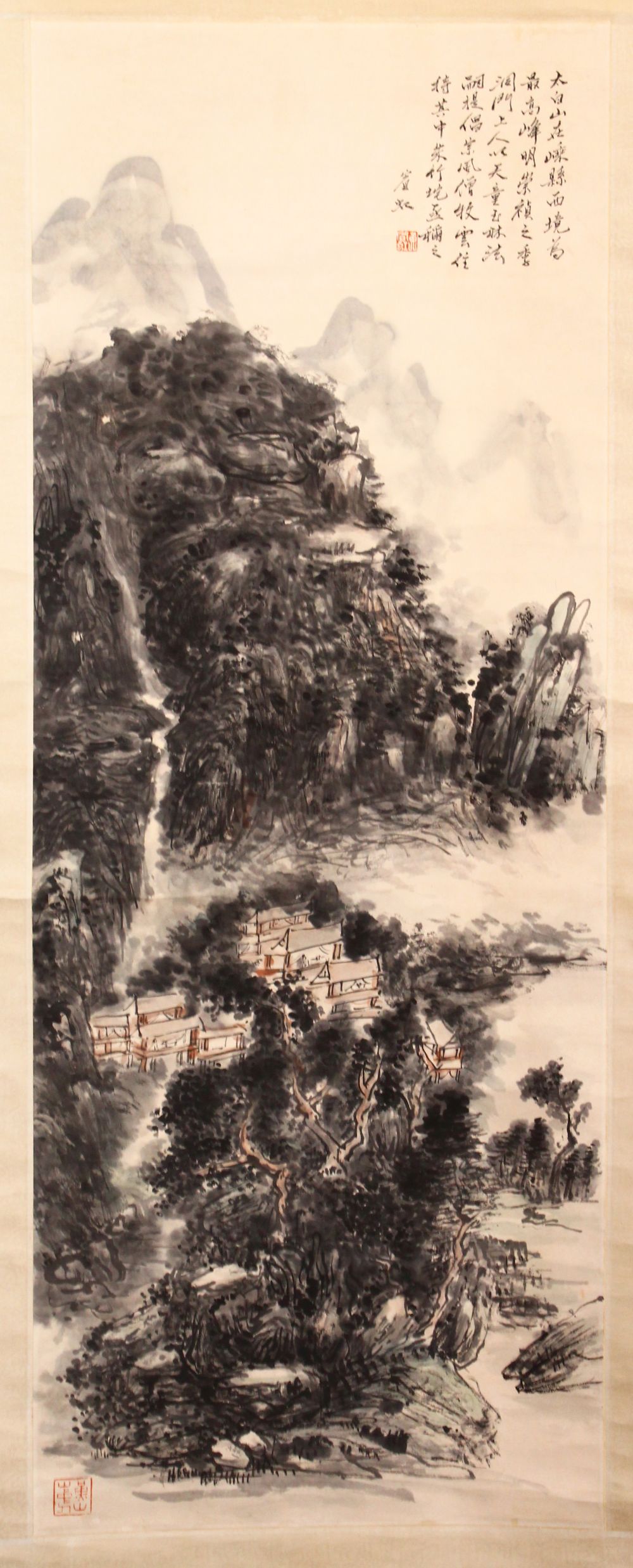 A 20TH CENTURY CHINESE SCROLL PAINTING, depicting a mountainous landscape, image 112cm x 42cm.