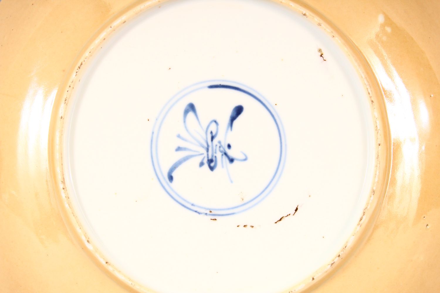 A CHINESE KANGXI BLUE AND WHITE PORCELAIN PLATE, painted with panels of flowers within a - Image 3 of 3