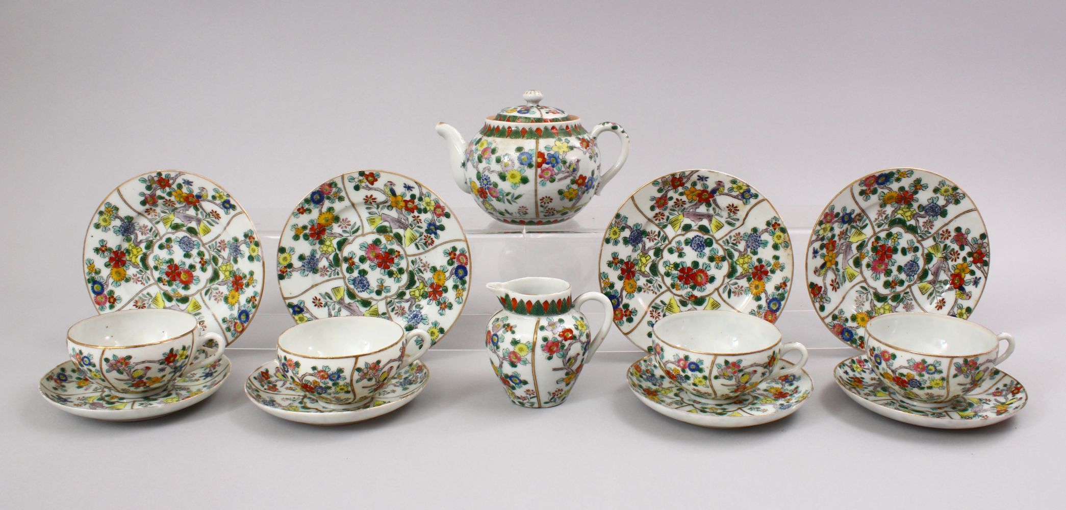 AN ORIENTAL FAMILLE ROSE PORCELAIN PART TEA SERVICE, WITH FLORAL DECORATION, the bases with black