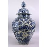 A LARGE EARLY 16TH / 17TH CENTURY JAPANESE BLUE & WHITIE IMARI PORCELAIN VASE & COVER, The octagonal