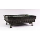 A CAST BRONZE RECTANGULAR BONSAI PLANTER, cast a key border and shield shaped motifs on curving