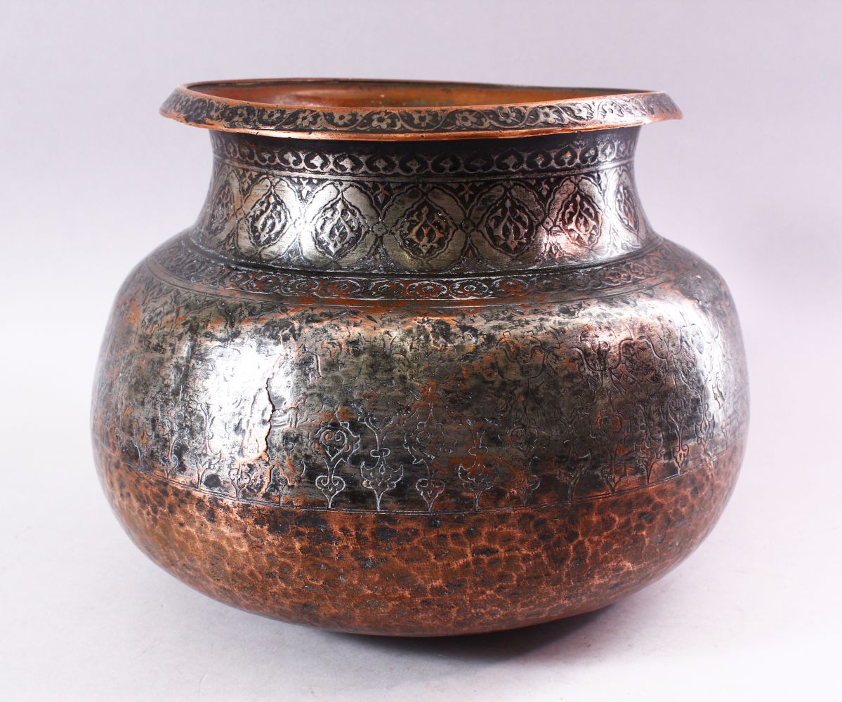 A 17TH CENTURY INDIAN TINNED COPPER LARGE CIRCULAR BOWL, with foliate engraved rim, the neck and