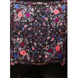 A 20TH CENTURY CHINESE EMBROIDERED BLACK SILK PIANO SHAWL / TEXTILE, with floral embroidery and