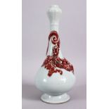A CHINESE COPPER RED GARLIC HEAD PORCELAIN CHILONG VASE, the monochrome body with iron red moulded