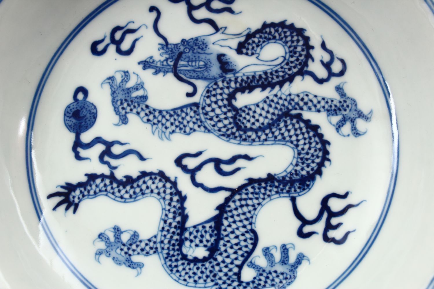 A CHINESE BLUE & WHITE PORCELAIN YONGZHENG STYLE DRAGON DISH, decorated with a central dragon, the - Image 2 of 4