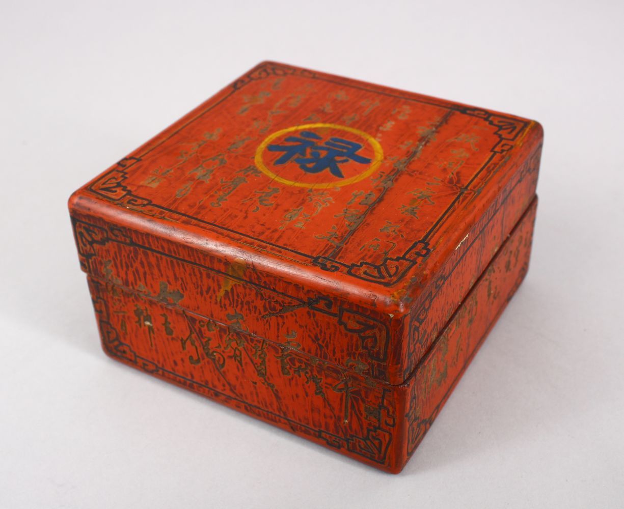 A CHINESE RED LACQUER SQUARE FORM CALLIGRAPHIC BOX & COVER, the base with a gilded mark, 12cm