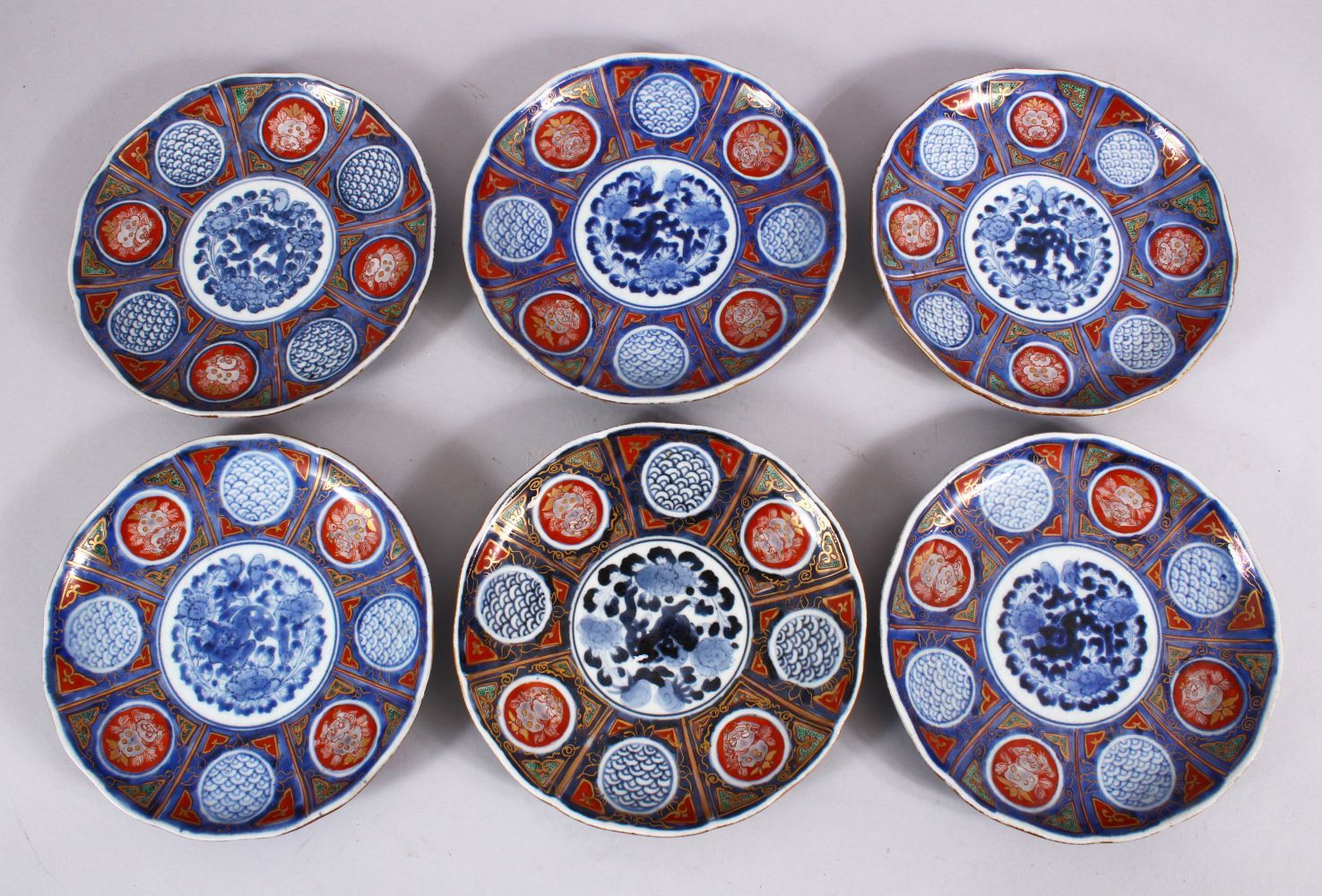 A SET OF SIX JAPANESE MEIJI PERIOD IMARI PORCELAIN PLATES decorated with typical imari palate,