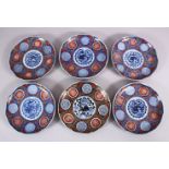A SET OF SIX JAPANESE MEIJI PERIOD IMARI PORCELAIN PLATES decorated with typical imari palate,