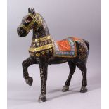 A KASHMIRI PAINTED CARVED WOOD MODEL OF A PRANCING HORSE, 38cm long