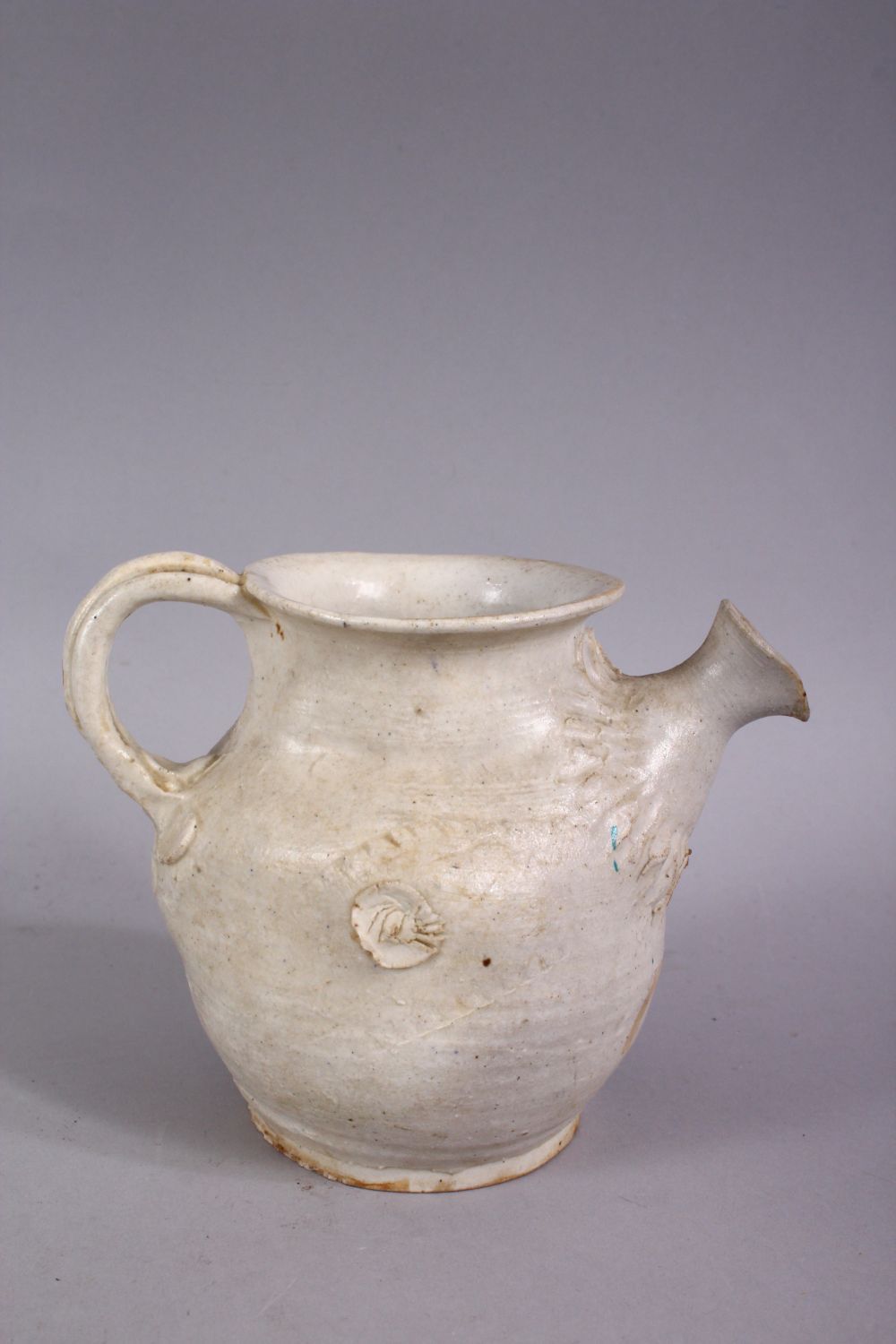 AN EARLY CHINESE POTTERY JUG, with floral decoration, 11cm high. - Image 3 of 4